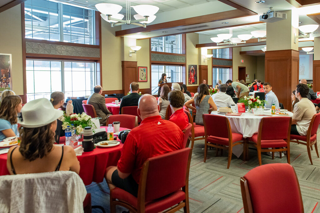 faculty member speaking at the podium