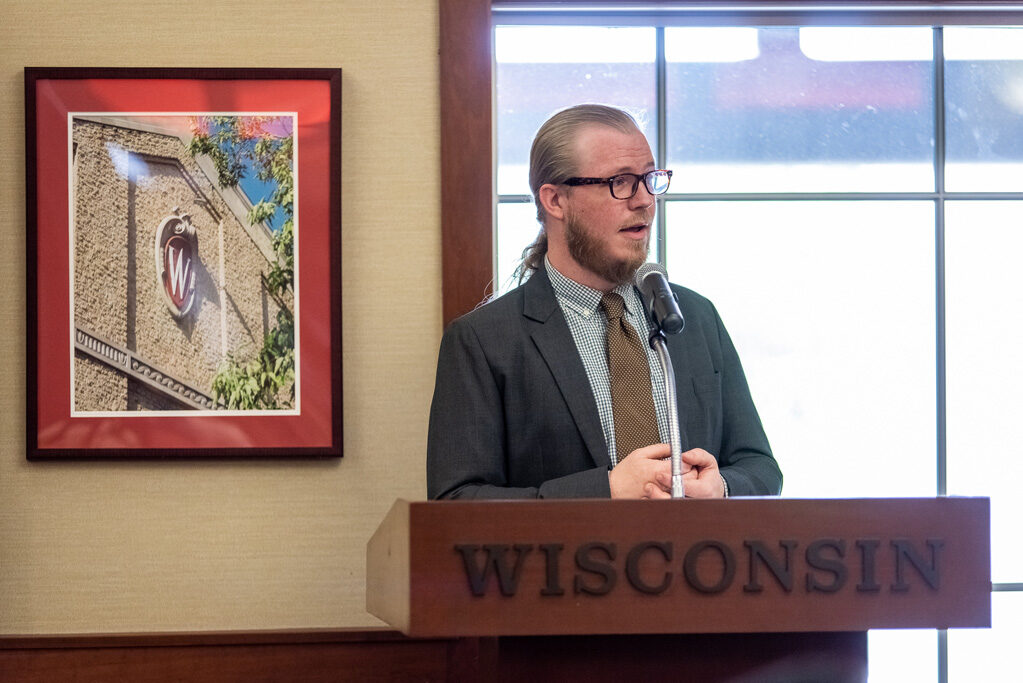 Faculty member speaking at the podium