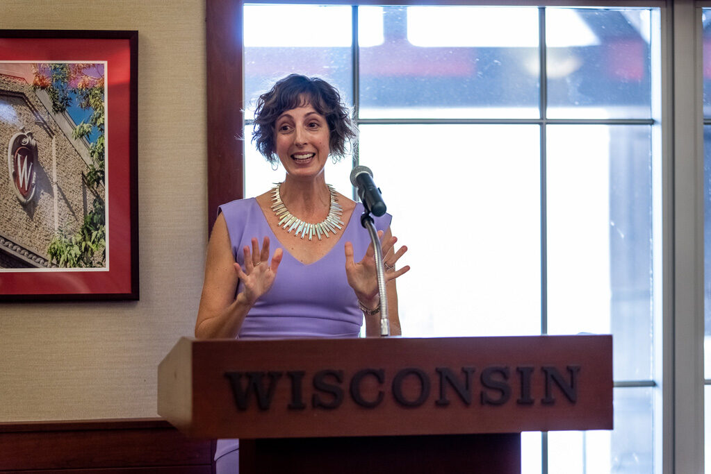 Allison Gardner speaking at the podium