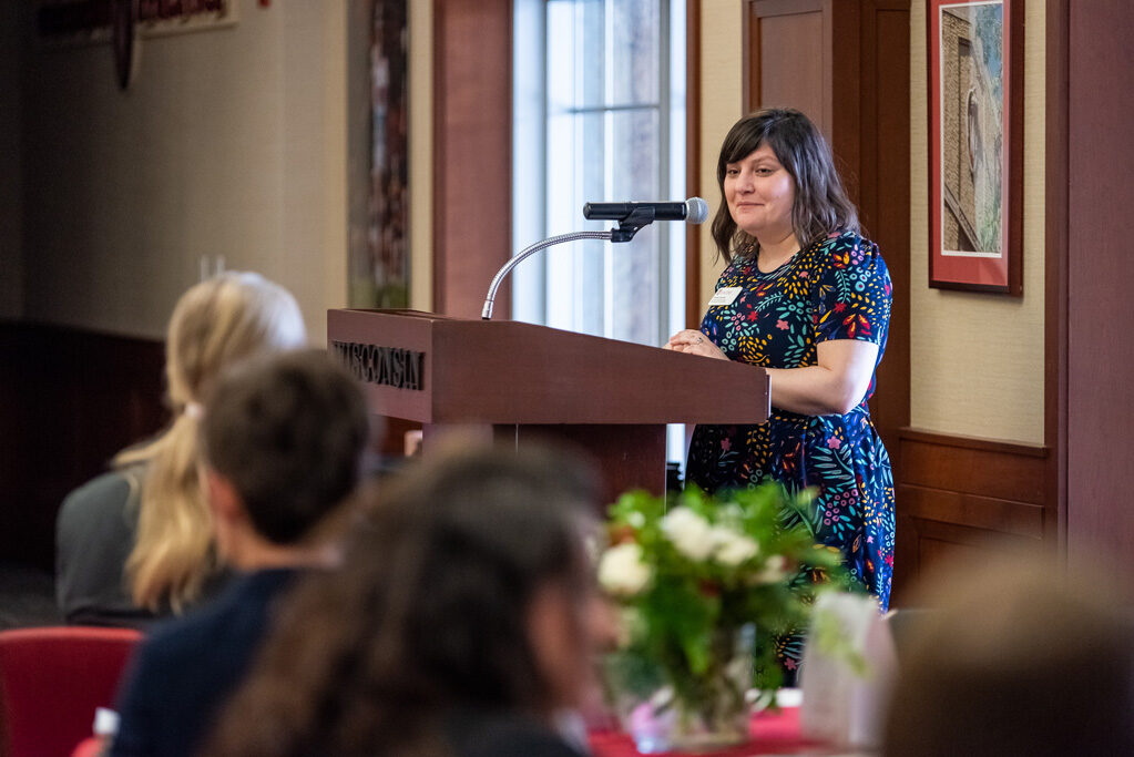 Faculty speaking at the podium