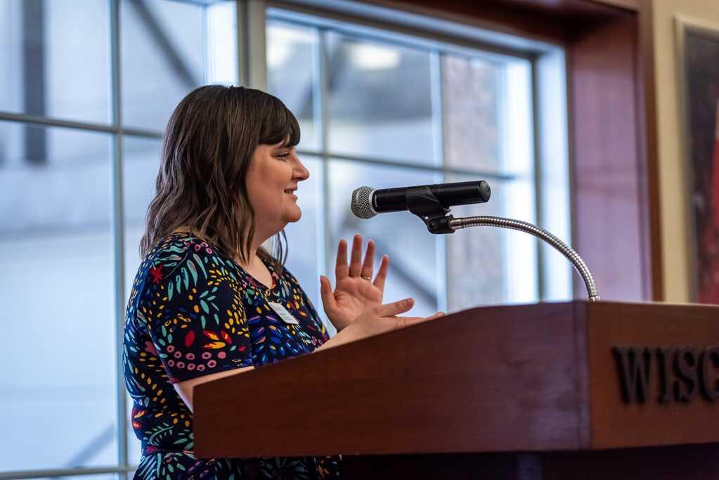 Faculty speaking at the podium