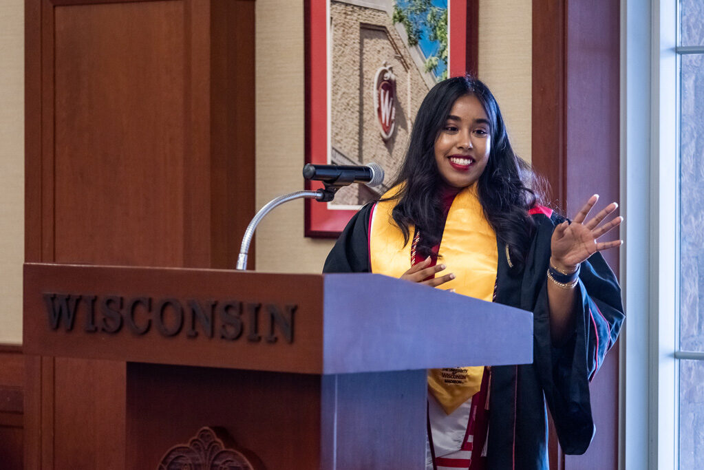 Graduated student speaking at the podium