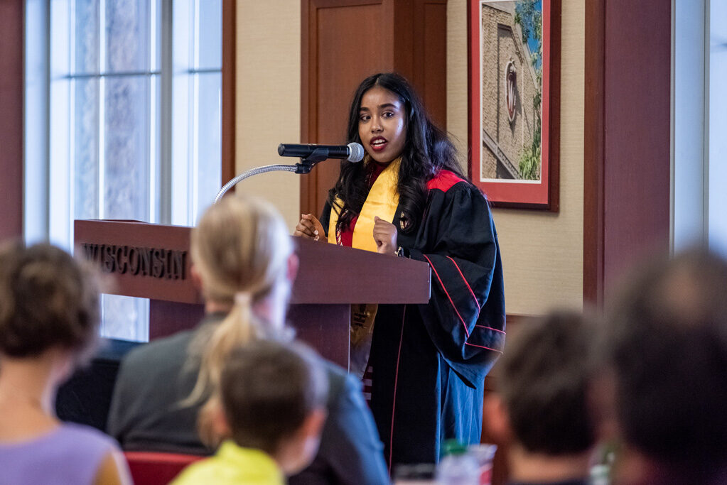 Graduated student speaking at the podium