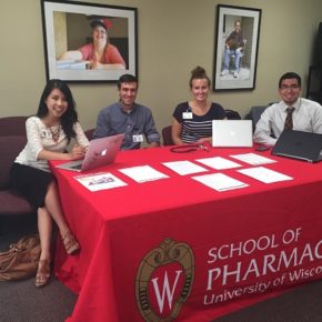 Students and staff running School of Pharmacy table