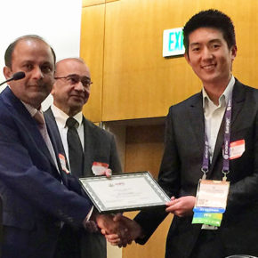 Rattavut Teerakapibal receiving his AAiPS award.