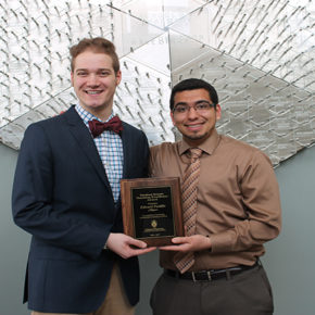 Student Senate Chairperson, Daniel Bruckbauer, DPH-4, (left) presents Edward Portillo, assistant faculty associate in the Pharmacy Practice Division, with the 2016-2017 Student Senate Teaching Excellence Award.