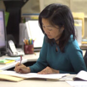 Michelle Chui working at her desk