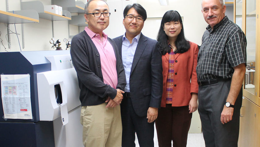 Glen Kwon, Seungpyo Hong, Lingjun Li, and Sandro Mecozzi standing in a lab