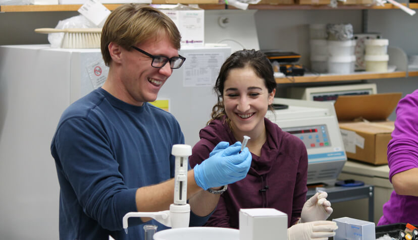 Smiling Pharmacy Toxicology students working in the lab