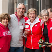 A group of alumni at the School of Pharmacy tailgate.