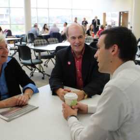 Duane Kirking (BS ‘74), center, with wife Marilyn, meet with their scholarship recipient, PharmD student Eric Friestrom.