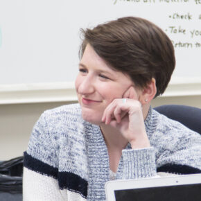 Taylor Watterson smiling in a classroom