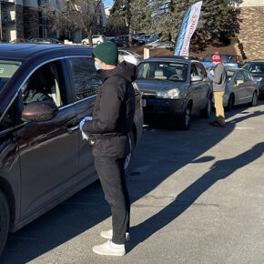 PharmD students speaking with patients in their cars.