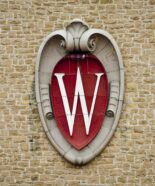 A W crest emblem is seen on the Field House from inside of Camp Randall Stadium at the University of Wisconsin-Madison on Oct. 6, 2012. (Photo by Bryce Richter / UW-Madison)