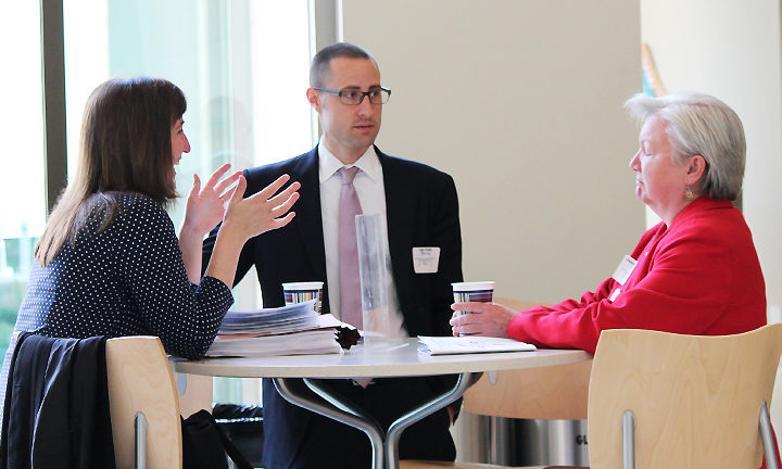 Joe Zorek speaking with Jeanette Roberts and another woman