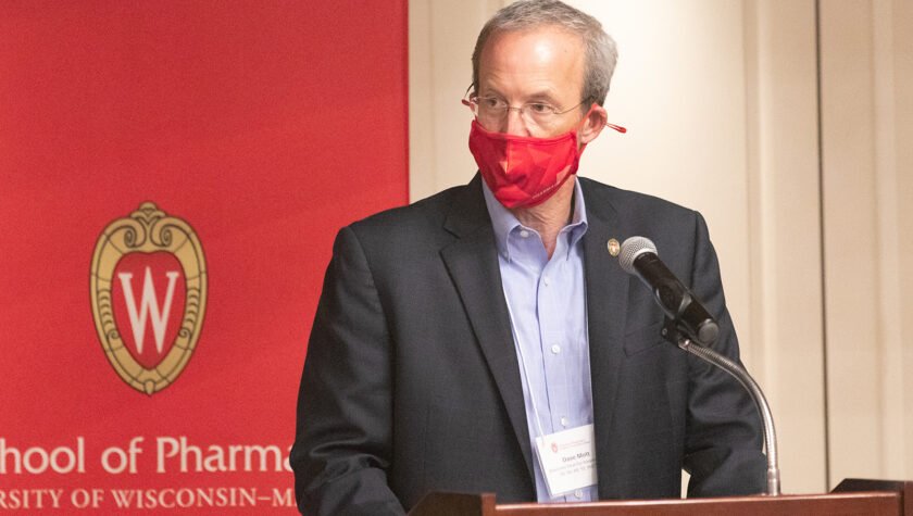 Dave Mott speaking at the podium