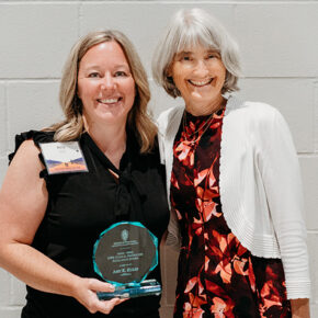 Amy Kulig holding her glass IPPE Clinical Instructor Excellence Award