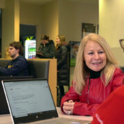 Nancy Gilbride speaking with two PharmD students