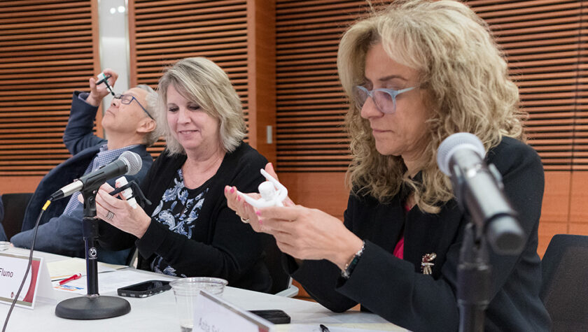 Roger Tung, Deb Fluno, and Azita Saleki-Gerhardt consider the MyDropper examples in their hands.