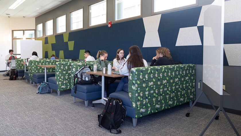 Students studying at booth-style tables