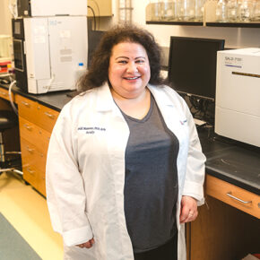 Heidi Mansour smiles in her lab