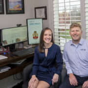 Jesse and Jessica Schaetzel pose in their home office