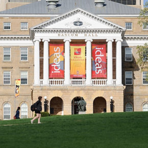 Pedestrians walk across Bascom Hill at the University of Wisconsin-Madison.