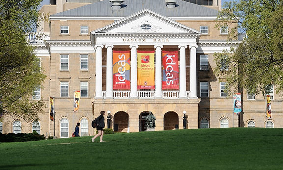 Pedestrians walk across Bascom Hill at the University of Wisconsin-Madison.