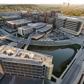 An aerial view of the western portion of the UW-Madison campus. Pictured (clockwise from bottom) are Rennebohm Hall, the Veterans Administration Hospital, UW Hospital and Clinics, Wisconsin Institutes for Medical Research and Health Sciences Learning Center (center).