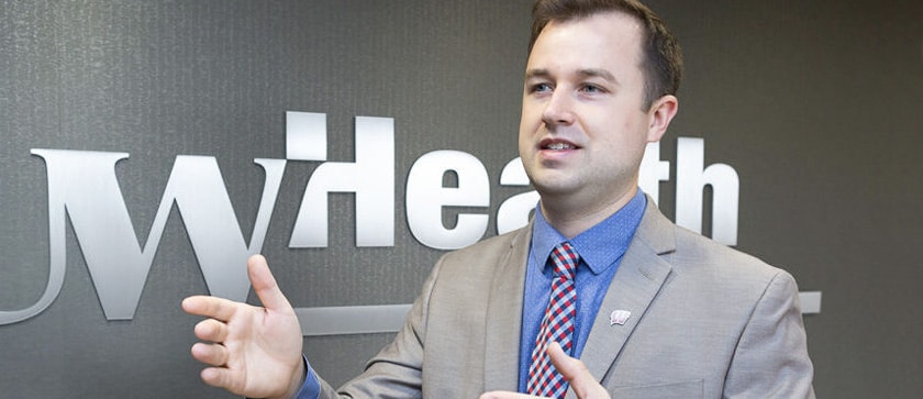 MS Pharmacy student Brandon Harkonen answers questions at a UW Health conference