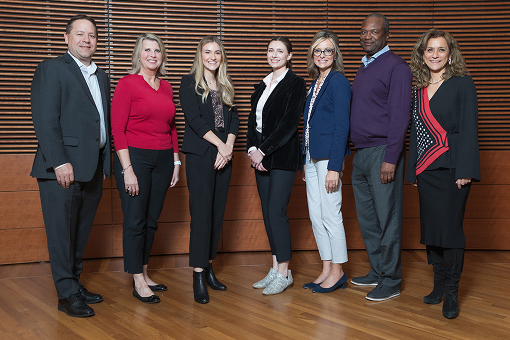 Brent Eberle, Debra Fluno, Elle Noone, Alexis Doering, Beth Martin, Bruce Scott, and Azita Saleki-Gerhardt at the School's 2023 SHARx Tank competition. | Photo by Todd Brown