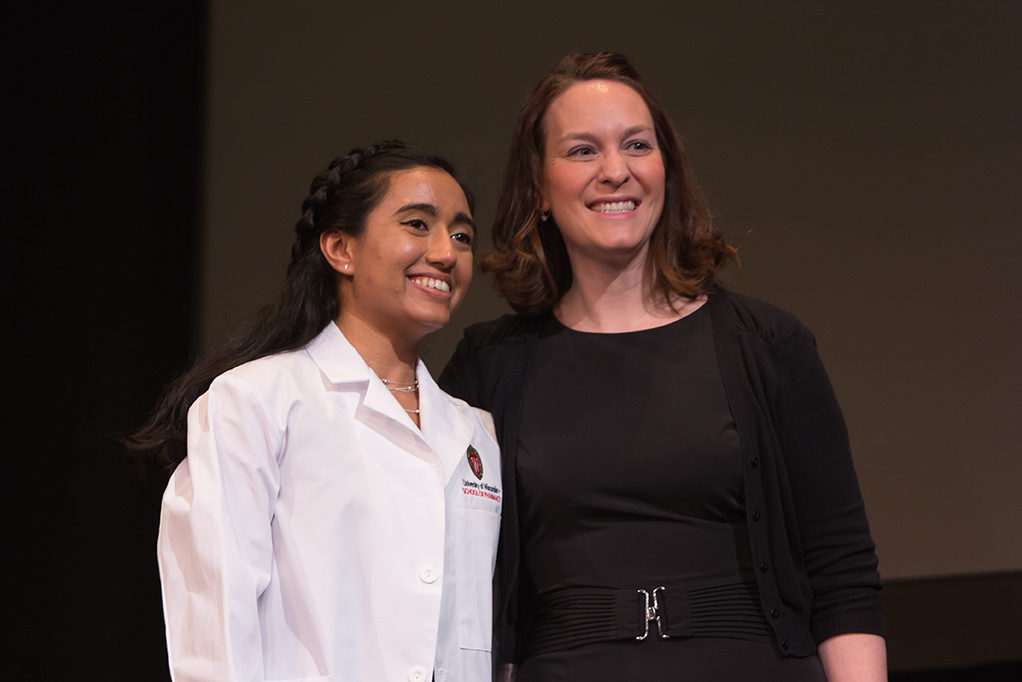 Students dress with the white coat to symbolize the achievement they have at the School.