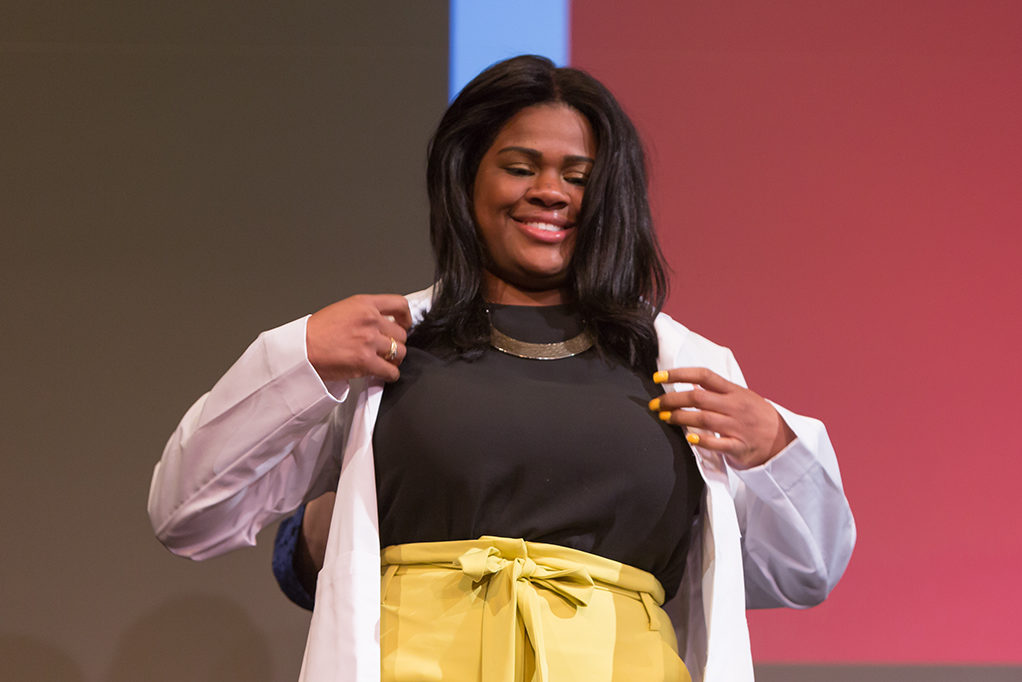 Students dress with the white coat to symbolize the achievement they have at the School.