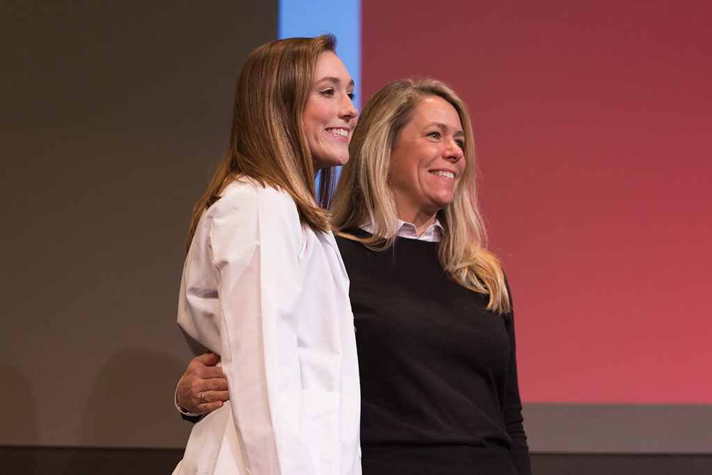 Students dress with the white coat to symbolize the achievement they have at the School.