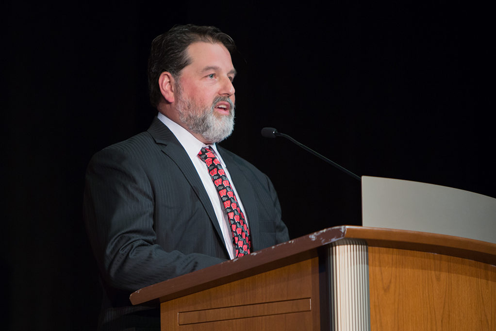 Mathew Mabie, president of Pharmacy Society of Wisconsin, delivers his message from the Society to the class.
