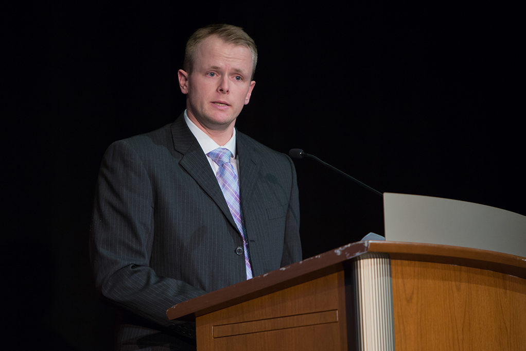Nathaniel Smith, president of Pharmacy Alumni Association, gives his message to the class as an alumnus.