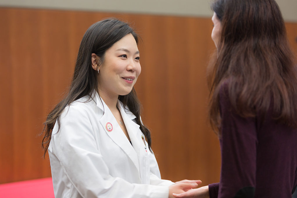 A student pharmacist accepts award from Kim Lintner.