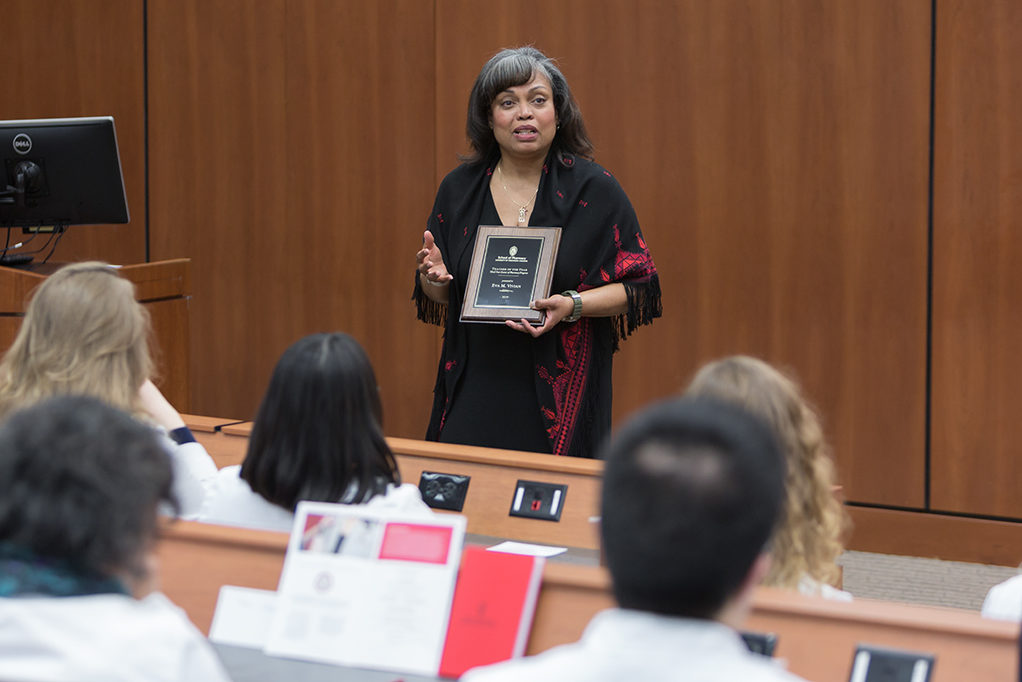 Dr. Eva Vivian presents in front of her students.