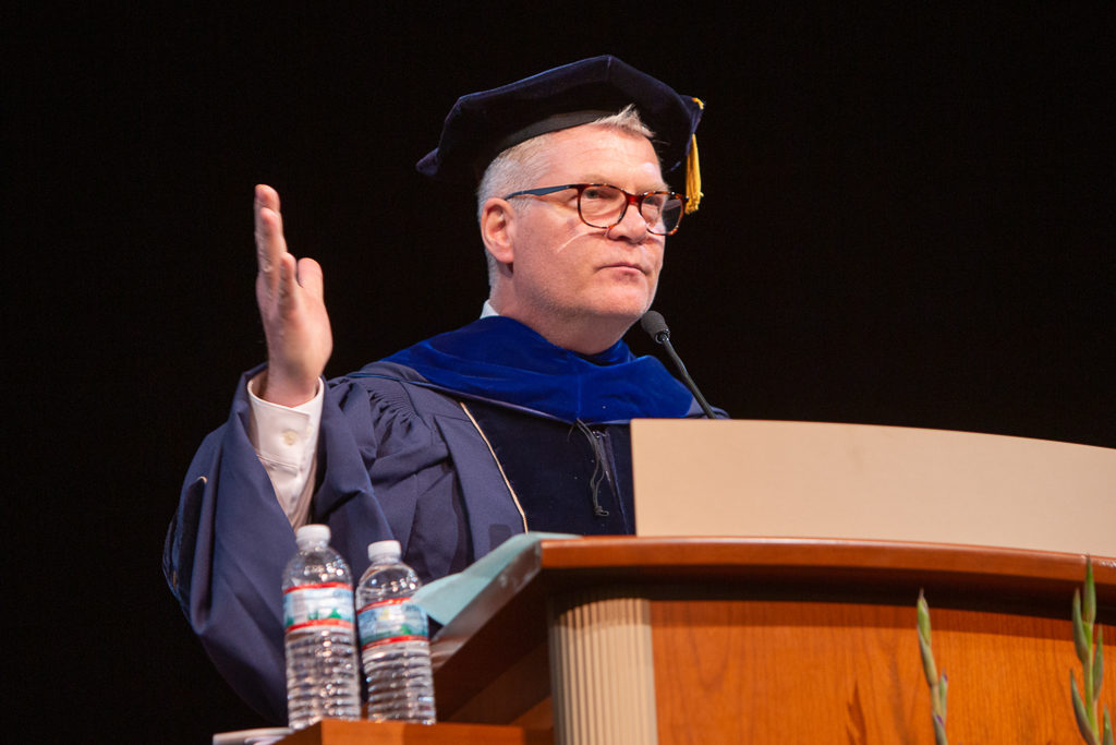 Richard Bertz, alumni of the School, delivers his message to encourage the graduates.