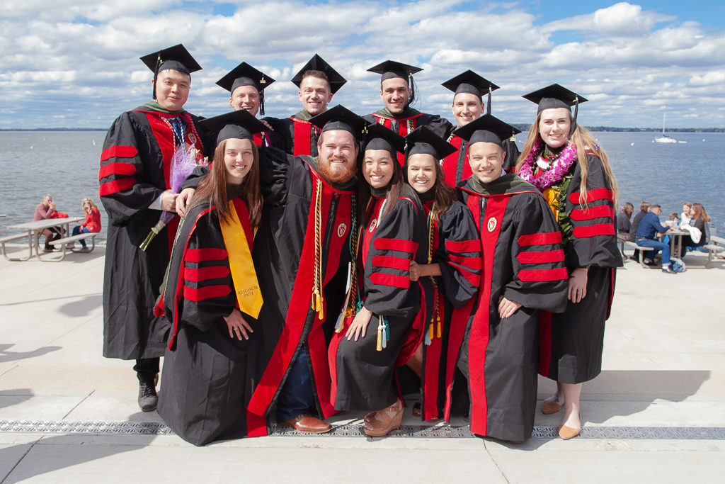 Students celebrate the moment with a group photo of everyone in their graduation robes