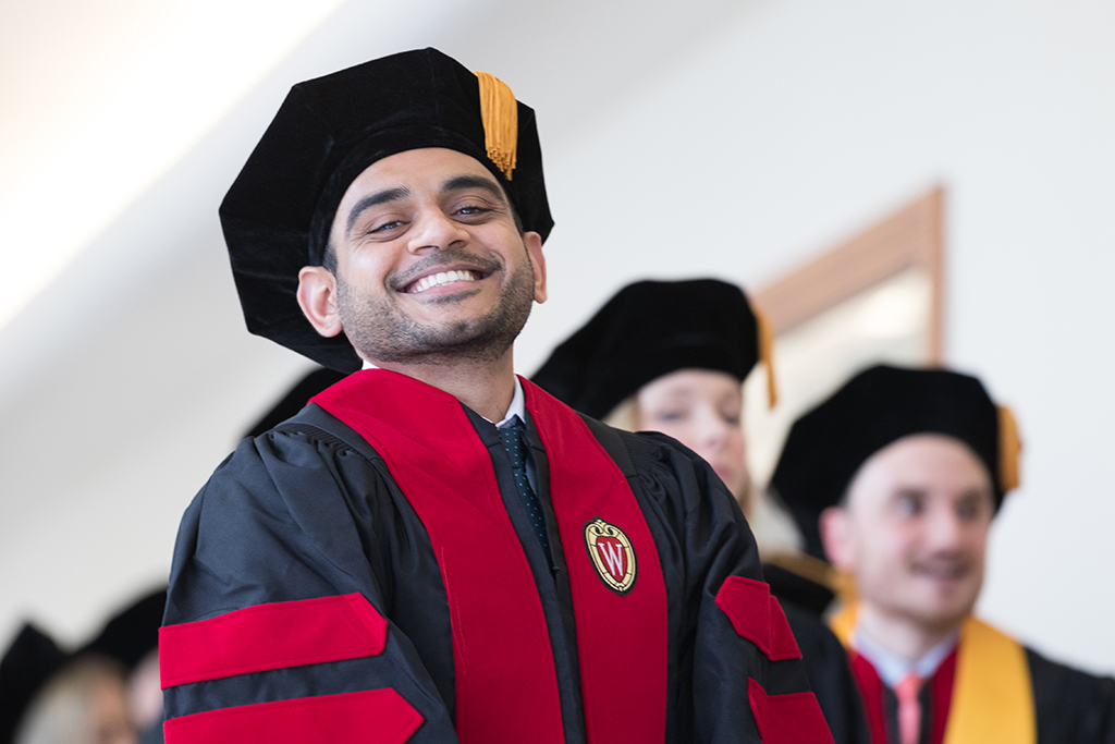 Students line the halls of the Union before the Hooding Ceremony begins.