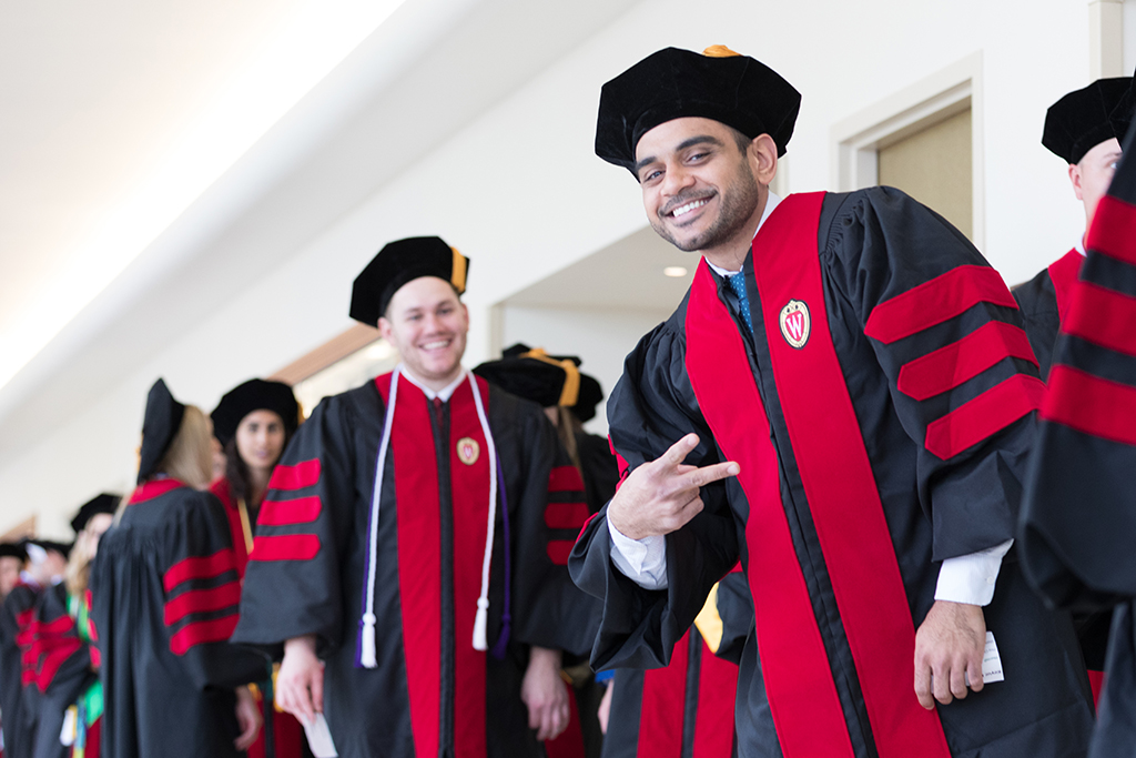 Students line the halls of the Union before the Hooding Ceremony begins.
