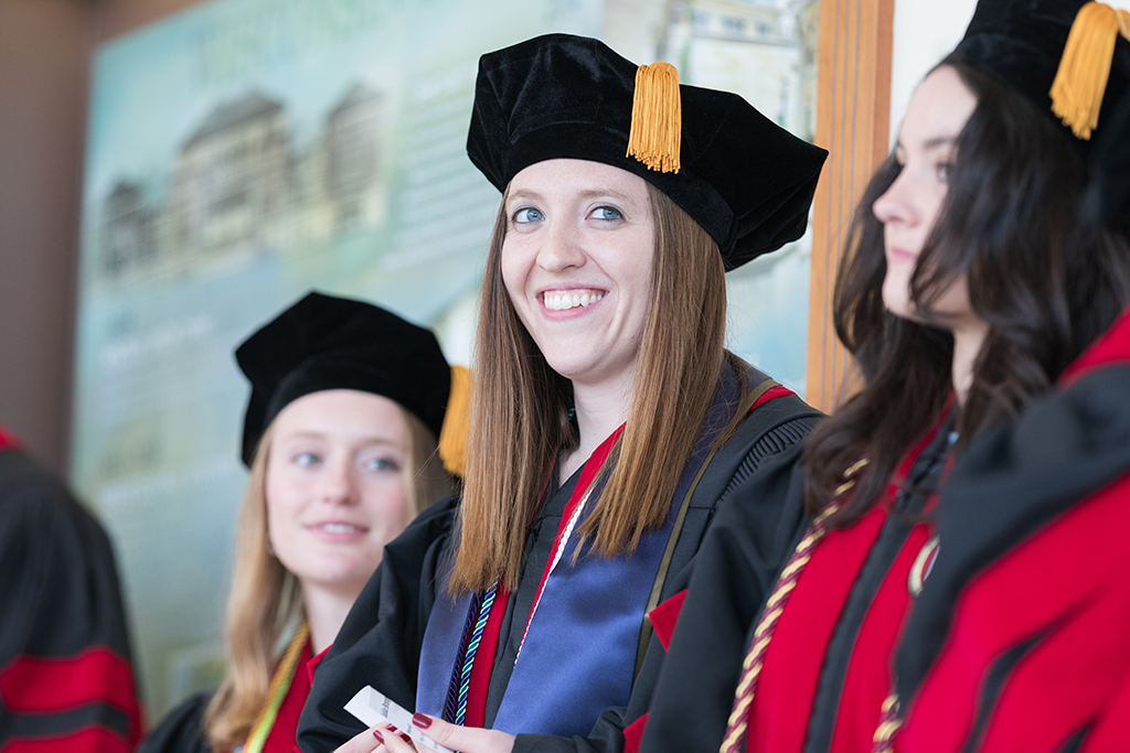 Students line the halls of the Union before the Hooding Ceremony begins.