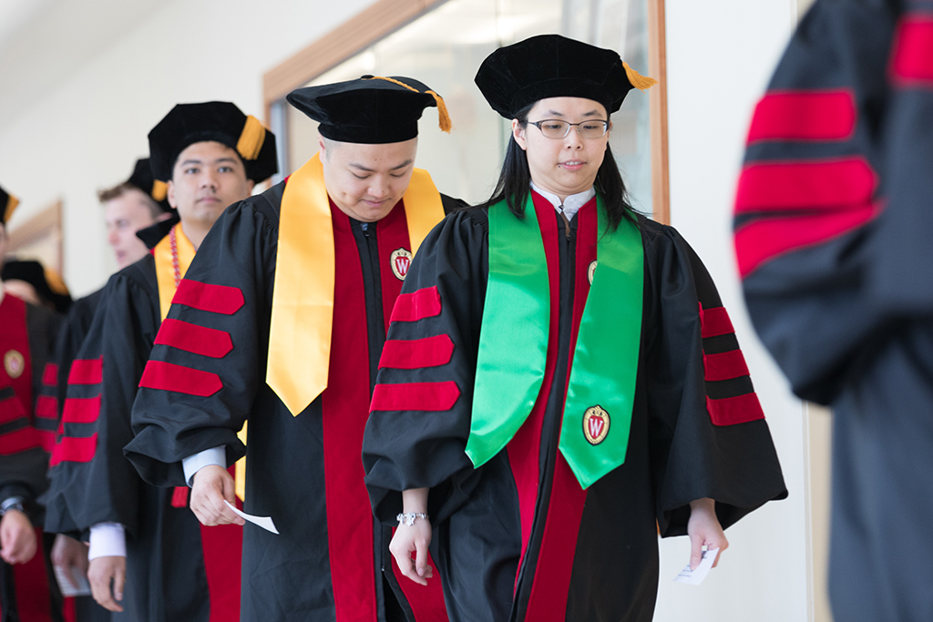 Students line the halls of the Union before the Hooding Ceremony begins.