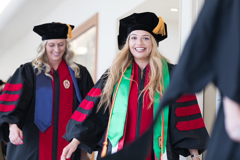 Students line the halls of the Union before the Hooding Ceremony begins.