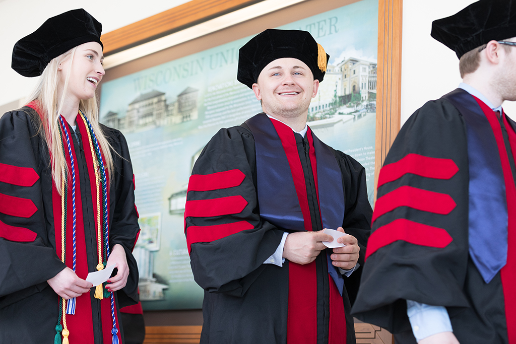 Students line the halls of the Union before the Hooding Ceremony begins.