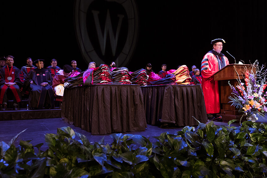 Dean Steve Swanson speaks at the podium.