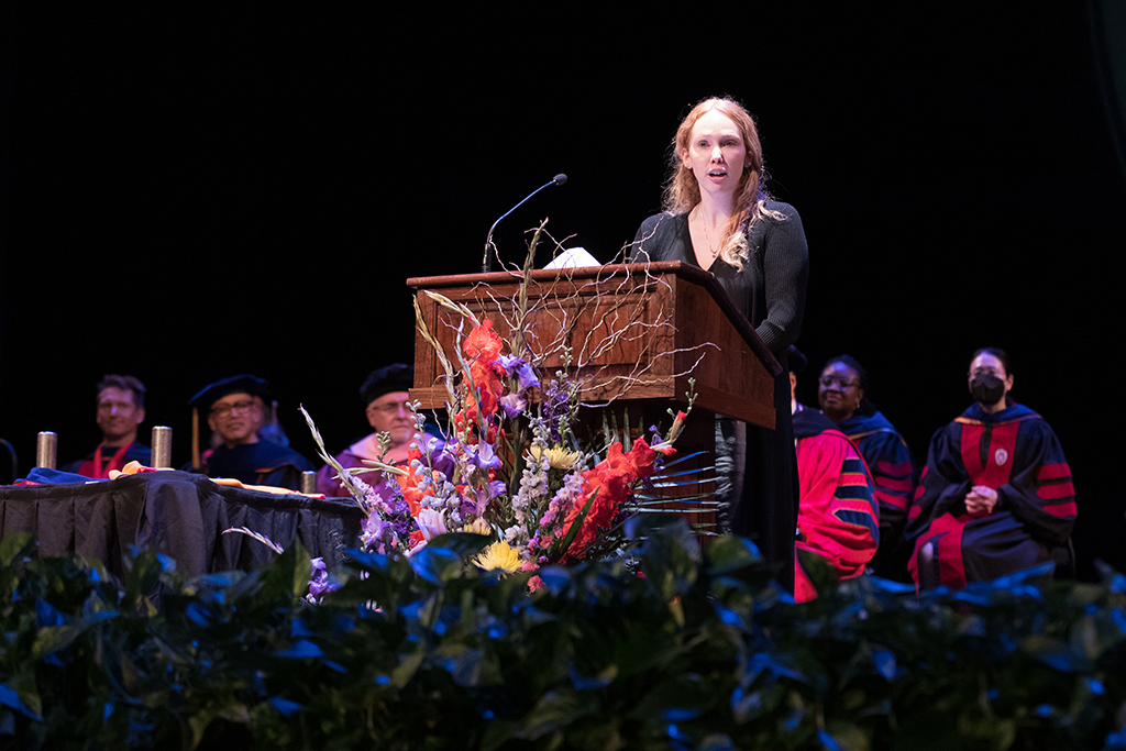 Heather Spatchek speaks at the podium.