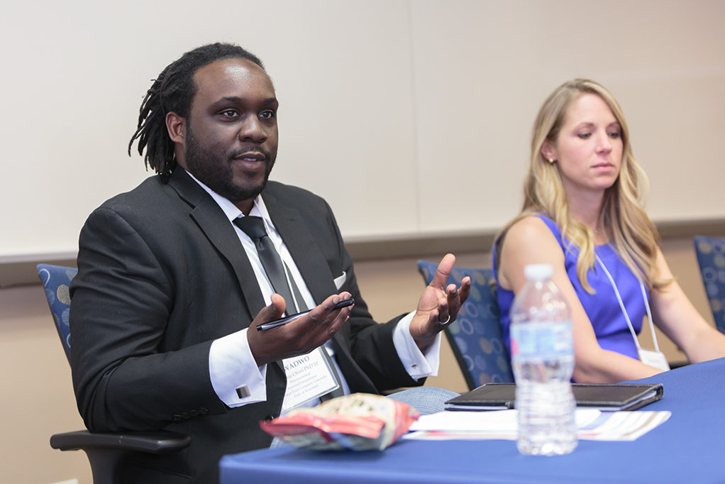 Kwadwo Owusu-Ofori and Jeanine Burmania sitting on speaking panel