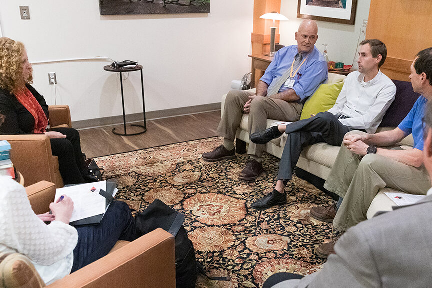 Chancellor Mnookin sitting with SoP staff